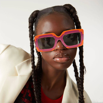 Komono Lana Solar Nebula Sonnenbrille solid smoke getönte Gläser, pink-orange Rahmen, style
